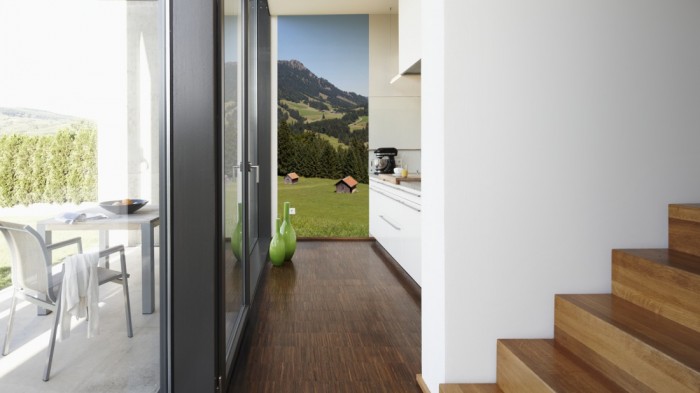 Ein Foto von dem 3D-Fotopanel Blick durch das Tal der Berge tapeziert in der Küche. Bestelle Deine Bildtapete online.