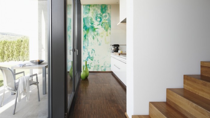 Ein Foto von dem Design-Fotopanel Unter den Palmen Grün tapeziert in der Küche. Bestelle Deine Bildtapete online.