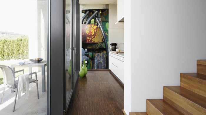 Ein Foto von dem 3D-Fotopanel Detailbild eines alten Roboters tapeziert in der Küche. Bestelle Deine Bildtapete online.