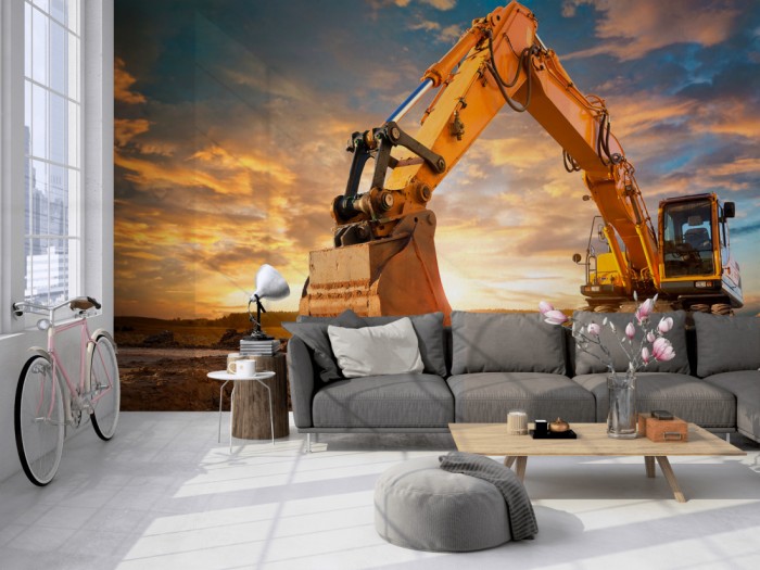 Die Fototapete Gelber Bagger bei Sonnenaufgang auf einer großen Wand im Loft tapeziert. Die Fototapete Gelber Bagger bei Sonnenaufgang wird individuell auf Deine Wand angepasst.