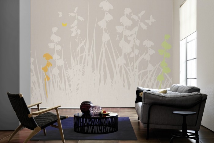 Im Wohnzimmer die Design-Fototapete Blumenwiese Herbst, Artwork auf einer großen Wand tapeziert. Die Design-Fototapete Blumenwiese Herbst, Artwork ist als Vlies-Fototapete im Wohnzimmer leicht zu tapezieren.