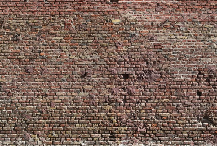 Die Fototapete Ziegel Wand, Steine im Sonnenschein, eine Vlies-Fototapete bei Livingwalls Cologne online kaufen. Die Fototapete Ziegel Wand, Steine im Sonnenschein ist eine Fototapete auf Maß.