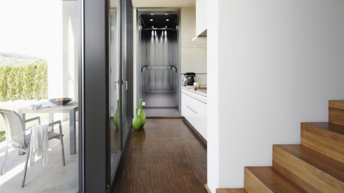 Ein Foto von dem 3D Fotopanel Moderner Aufzug tapeziert in der Küche. Bestelle Deine Bildtapete online.