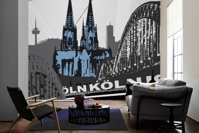 Im Wohnzimmer die Design-Fototapete Köln Deutschland, Artwork auf einer großen Wand tapeziert. Die Design-Fototapete Köln Deutschland, Artwork ist als Vlies-Fototapete im Wohnzimmer leicht zu tapezieren.
