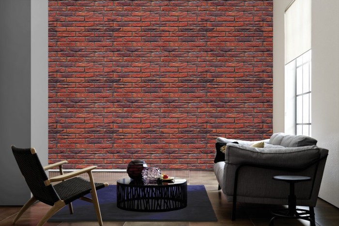 Im Wohnzimmer die Fototapete Ziegel Wand, moderner Stein auf einer großen Wand tapeziert. Die Fototapete Ziegel Wand, moderner Stein ist als Vlies-Fototapete im Wohnzimmer leicht zu tapezieren.