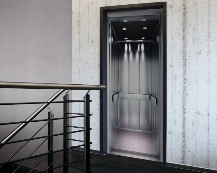 Ein Foto von der selbstklebenden Türtapete Moderner Aufzug tapeziert auf einer Tür. Bestelle Deine Türtapete online.