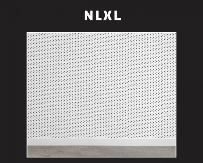 Die NLXL Tapete TTY-01 Particles von Truly Truly tapeziert an einer Wand.
