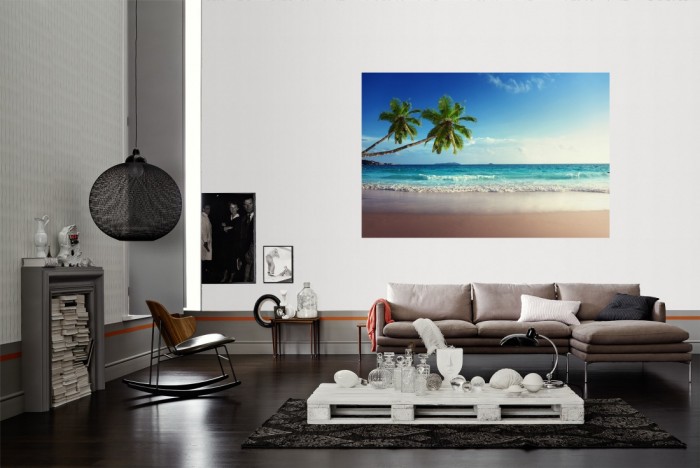 Die Fototapete Strand mit Palmen auf den Seychellen als Wandbild im Wohnzimmer. Die Vlies-Fototapete Strand mit Palmen auf den Seychellen verschönert als Wandbild Deine Wand.