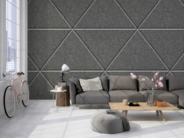 Die Fototapete Filz Dreiecke auf einer großen Wand im Loft tapeziert. Die Fototapete Filz Dreiecke wird individuell auf Deine Wand angepasst.