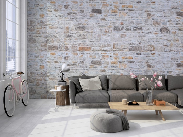 Die Fototapete Stein Wand, heller Naturstein auf einer großen Wand im Loft tapeziert. Die Fototapete Stein Wand, heller Naturstein wird individuell auf Deine Wand angepasst.