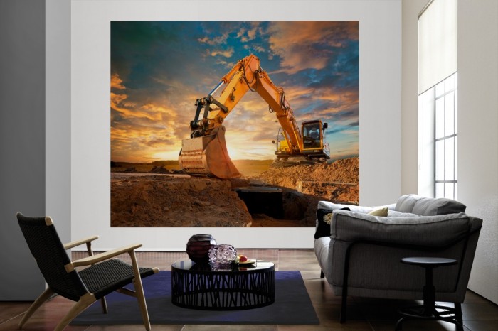 Die Fototapete Gelber Bagger bei Sonnenaufgang als große Bildtapete im Wohnzimmer. Als Bildtapete ist die Fototapete Gelber Bagger bei Sonnenaufgang ein besonderes Highlight auf Vliestapete.