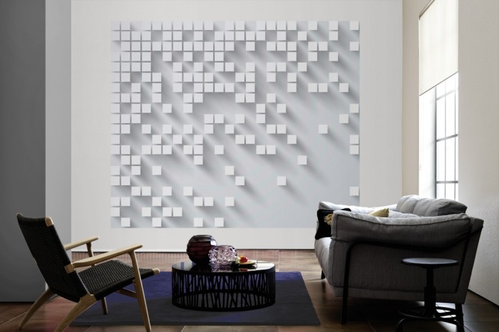 Die Design-Fototapete 3D-Geometrie graue Würfel als große Bildtapete im Wohnzimmer. Als Bildtapete ist die Design-Fototapete 3D-Geometrie graue Würfel ein besonderes Highlight auf Vliestapete.
