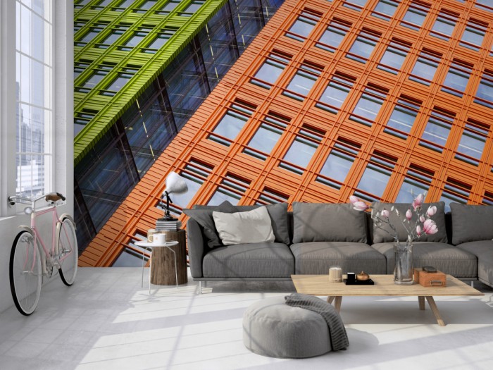 Die Fototapete Wolkenkratzer Fassaden auf einer großen Wand im Loft tapeziert. Die Fototapete Wolkenkratzer Fassaden wird individuell auf Deine Wand angepasst.