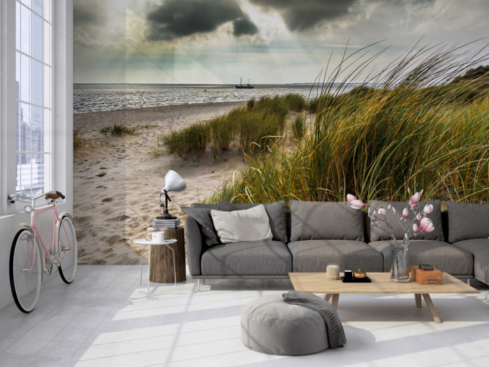 Die Fototapete Sylt, Düne am Meer nach Gewitter auf einer großen Wand im Loft tapeziert. Die Fototapete Sylt, Düne am Meer nach Gewitter wird individuell auf Deine Wand angepasst.