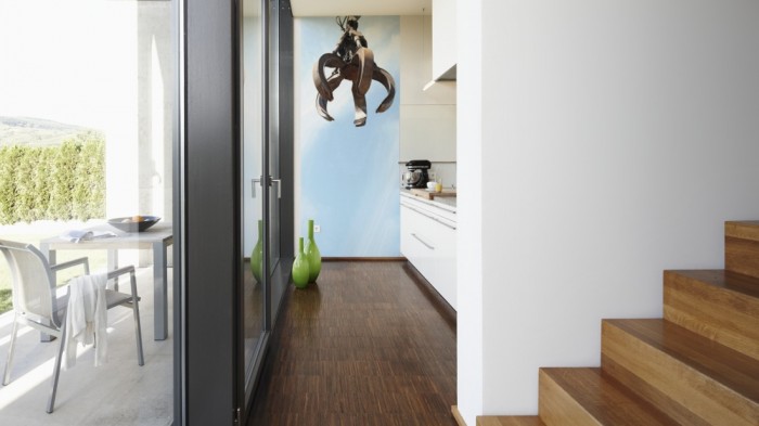 Ein Foto von dem 3D-Fotopanel Arm eines Baggers vom Schrottplatz tapeziert in der Küche. Bestelle Deine Bildtapete online.