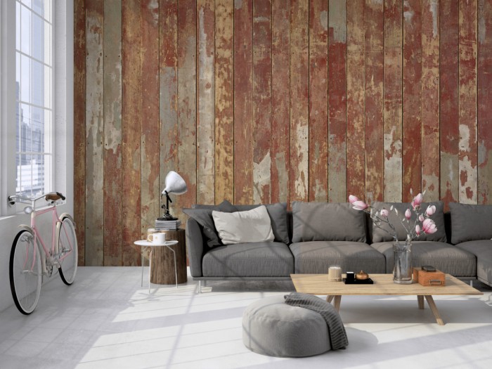 Die Fototapete Holz Wand, alte Holzdielen in rot auf einer großen Wand im Loft tapeziert. Die Fototapete Holz Wand, alte Holzdielen in rot wird individuell auf Deine Wand angepasst.