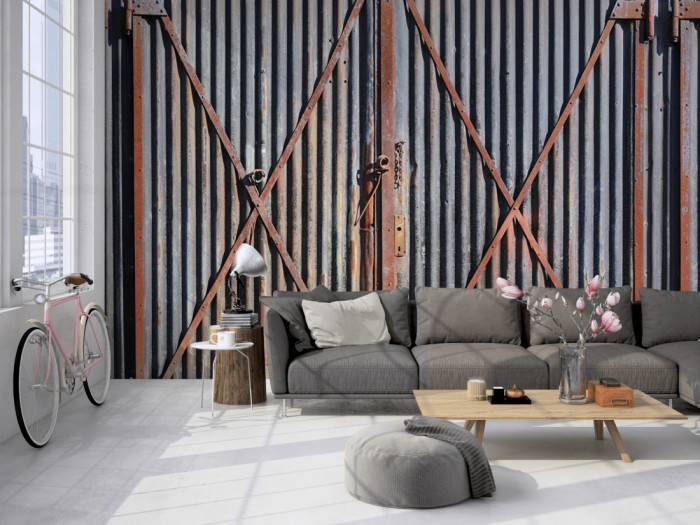 Die Fototapete Rost Wand, Containertüren auf einer großen Wand im Loft tapeziert. Die Fototapete Rost Wand, Containertüren wird individuell auf Deine Wand angepasst.