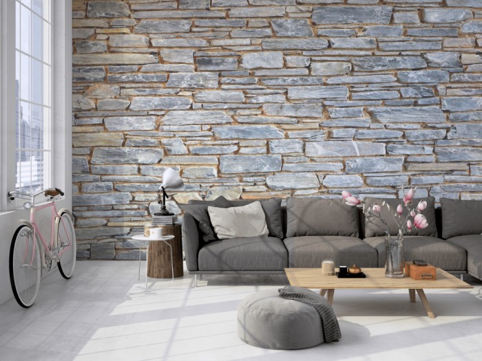 Die Fototapete Stein Wand, Naturstein grau auf einer großen Wand im Loft tapeziert. Die Fototapete Stein Wand, Naturstein grau wird individuell auf Deine Wand angepasst.