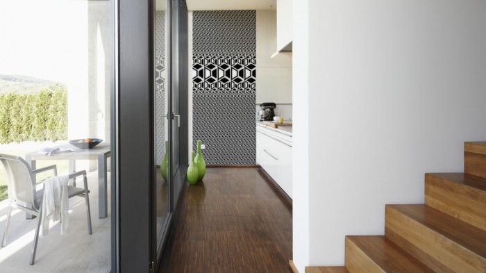 Ein Foto von dem 3D-Design-Fotopanel Illusion in schwarz weiß, Artwork tapeziert in der Küche. Bestelle Deine Bildtapete online.