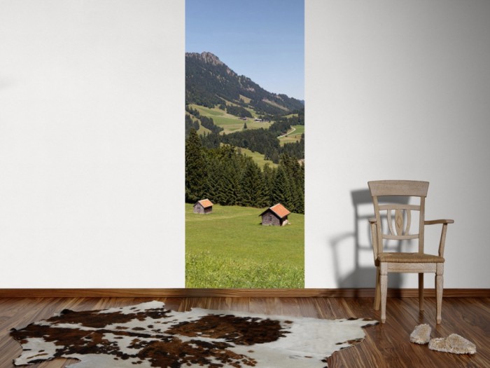 Ein Foto von dem 3D-Fotopanel Blick durch das Tal der Berge tapeziert an der Wand. Bestelle Deine Bildtapete online.