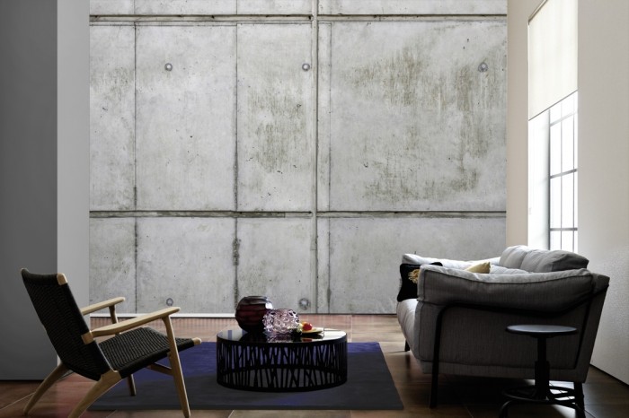 Im Wohnzimmer die Fototapete Beton Wand, Beton mit Stahlträger auf einer großen Wand tapeziert. Die Fototapete Beton Wand, Beton mit Stahlträger ist als Vlies-Fototapete im Wohnzimmer leicht zu tapezieren.