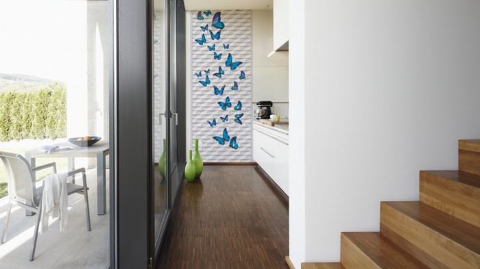 Ein Foto von dem 3D-Fotopanel Blaue Schmetteringe tapeziert in der Küche. Bestelle Deine Bildtapete online.