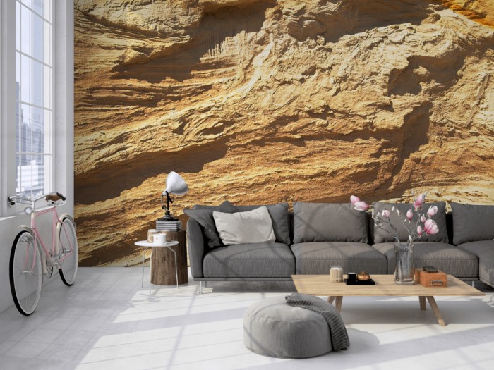 Die Fototapete Felswand, Sandstein auf einer großen Wand im Loft tapeziert. Die Fototapete Felswand, Sandstein wird individuell auf Deine Wand angepasst.