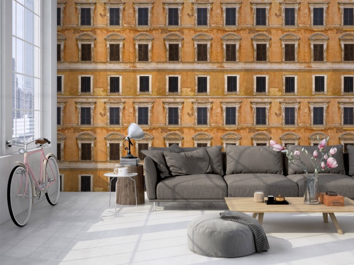 Die naturfarbene Designtapete Closed Facade Wallpaper als Wohnzimmertapete.