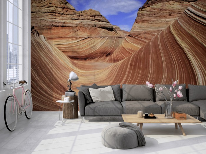 Die Fototapete The Wave in den Coyote Buttes, Arizona USA auf einer großen Wand im Loft tapeziert. Die Fototapete The Wave in den Coyote Buttes, Arizona USA wird individuell auf Deine Wand angepasst.