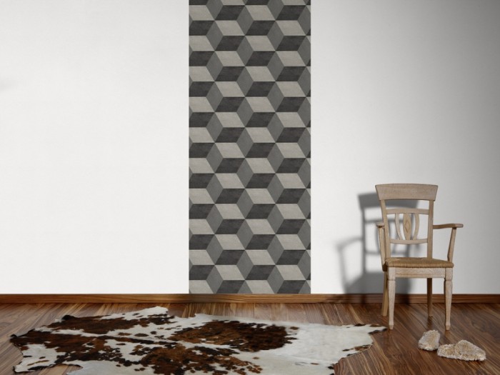 Ein Foto von dem 3D-Design-Fotopanel Würfel in Grau, Artwork tapeziert an der Wand. Bestelle Deine Bildtapete online.