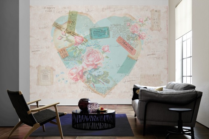 Im Wohnzimmer die Design-Fototapete Djooz Aquarell Herz mit Rosen auf einer großen Wand tapeziert. Die Design-Fototapete Djooz Aquarell Herz mit Rosen ist als Vlies-Fototapete im Wohnzimmer leicht zu tapezieren.