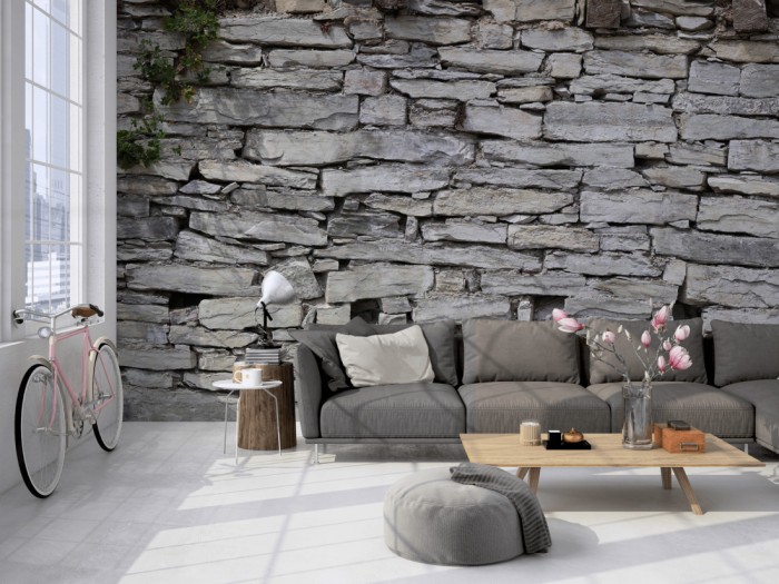 Die Fototapete Stein Wand, Naturstein alt auf einer großen Wand im Loft tapeziert. Die Fototapete Stein Wand, Naturstein alt wird individuell auf Deine Wand angepasst.