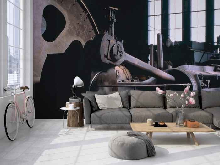 Die Fototapete Alte Dampfmaschine auf einer großen Wand im Loft tapeziert. Die Fototapete Alte Dampfmaschine wird individuell auf Deine Wand angepasst.