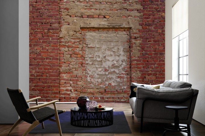 Im Wohnzimmer die Fototapete Ziegel Wand, Steine vermauert auf einer großen Wand tapeziert. Die Fototapete Ziegel Wand, Steine vermauert ist als Vlies-Fototapete im Wohnzimmer leicht zu tapezieren.
