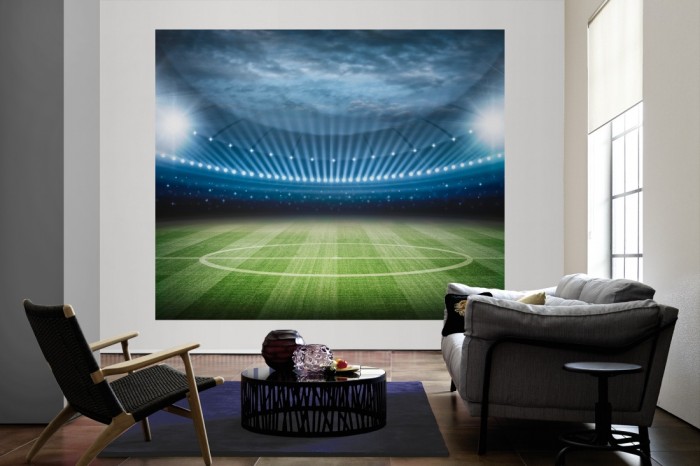 Die Fototapete Fußball Stadtion als große Bildtapete im Wohnzimmer. Als Bildtapete ist die Fototapete Fußball Stadtion ein besonderes Highlight auf Vliestapete.