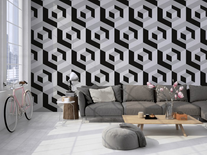 Die Design-Fototapete 3D-Geometrie Würfel in Grau auf einer großen Wand im Loft tapeziert. Die Design-Fototapete 3D-Geometrie Würfel in Grau wird individuell auf Deine Wand angepasst.