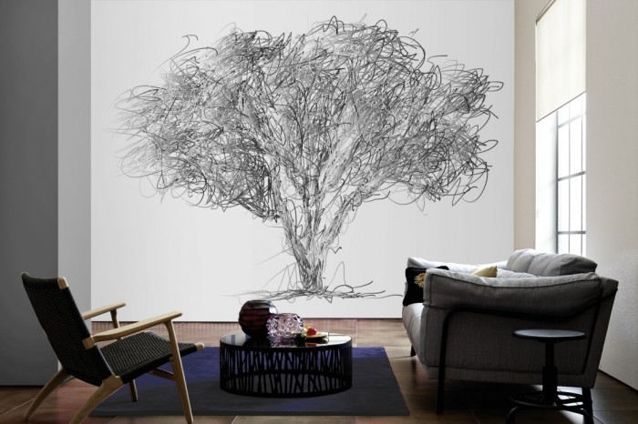 Im Wohnzimmer die Design-Fototapete Zeichnung eines Baumes auf einer großen Wand tapeziert. Die Design-Fototapete Zeichnung eines Baumes ist als Vlies-Fototapete im Wohnzimmer leicht zu tapezieren.