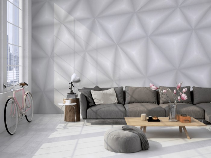 Die Design-Fototapete 3D-Geometrie graue Dreiecke auf einer großen Wand im Loft tapeziert. Die Design-Fototapete 3D-Geometrie graue Dreiecke wird individuell auf Deine Wand angepasst.