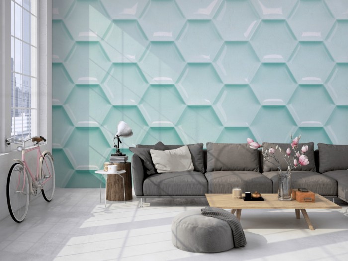 Die Design-Fototapete 3D-Effekt mit türkisen Waben auf einer großen Wand im Loft tapeziert. Die Design-Fototapete 3D-Effekt mit türkisen Waben wird individuell auf Deine Wand angepasst.