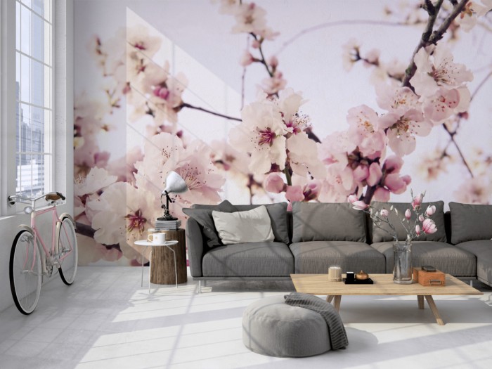 Die Fototapete Kirschblüten im Frühling auf einer großen Wand im Loft tapeziert. Die Fototapete Kirschblüten im Frühling wird individuell auf Deine Wand angepasst.