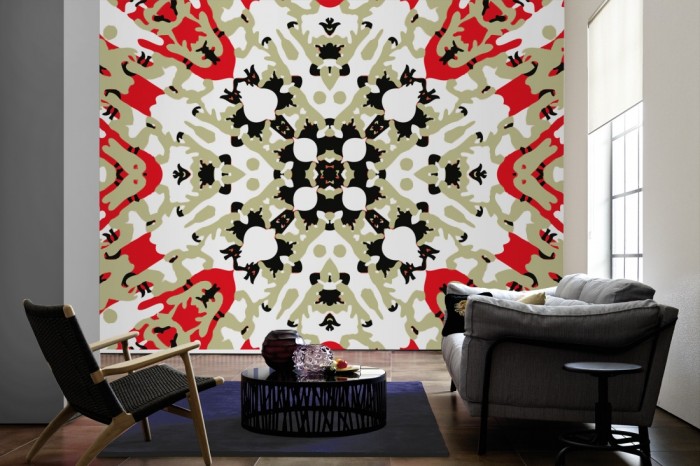 Im Wohnzimmer die Designer-Fototapete Kaleidoskop Camouflage, Artwork by Mylumi auf einer großen Wand tapeziert. Die Designer-Fototapete Kaleidoskop Camouflage, Artwork by Mylumi ist als Vlies-Fototapete im Wohnzimmer leicht zu tapezieren.