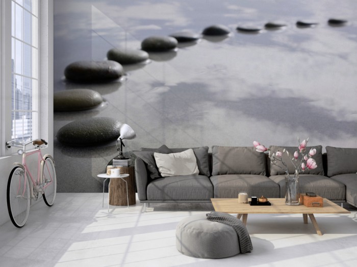 Die Fototapete Wellness, Wellness-Steine im Halbkreis auf einer großen Wand im Loft tapeziert. Die Fototapete Wellness, Wellness-Steine im Halbkreis wird individuell auf Deine Wand angepasst.