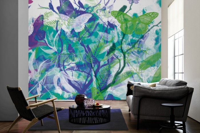Im Wohnzimmer die Designer-Fototapete Garten der Schmetterlinge, Artwork by Mylumi auf einer großen Wand tapeziert. Die Designer-Fototapete Garten der Schmetterlinge, Artwork by Mylumi ist als Vlies-Fototapete im Wohnzimmer leicht zu tapezieren.