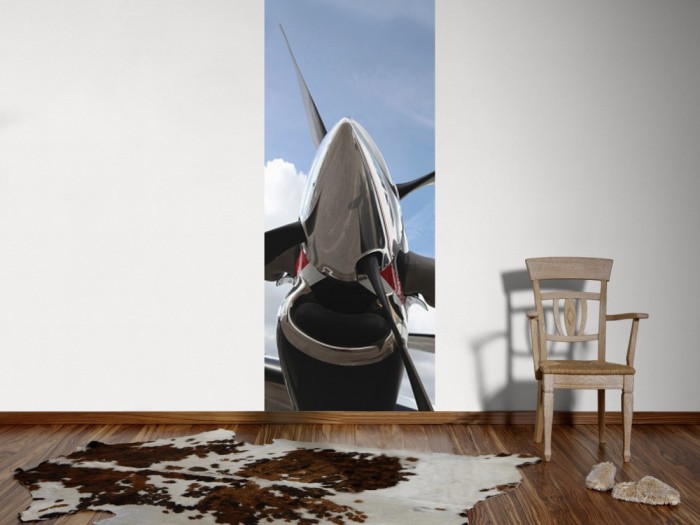 Ein Foto von dem 3D-Fotopanel Propeller eines Flugzeuges tapeziert an der Wand. Bestelle Deine Bildtapete online.