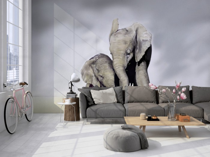 Die Fototapete Elefanten Familie auf einer großen Wand im Loft tapeziert. Die Fototapete Elefanten Familie wird individuell auf Deine Wand angepasst.