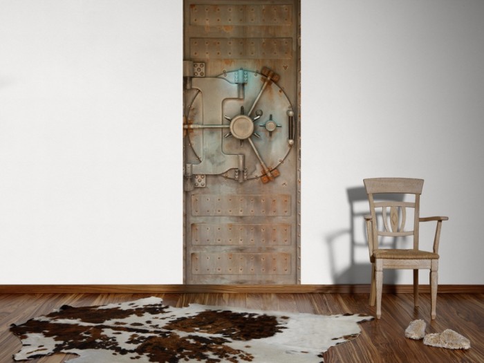 Ein Foto von dem 3D Fotopanel Alte Tresortür tapeziert an der Wand. Bestelle Deine Bildtapete online.