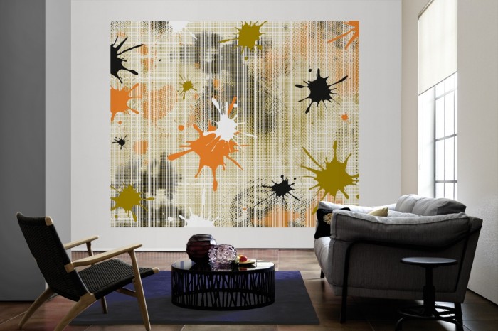 Die Design-Fototapete Geometrie Splash Grün als große Bildtapete im Wohnzimmer. Als Bildtapete ist die Design-Fototapete Geometrie Splash Grün ein besonderes Highlight auf Vliestapete.