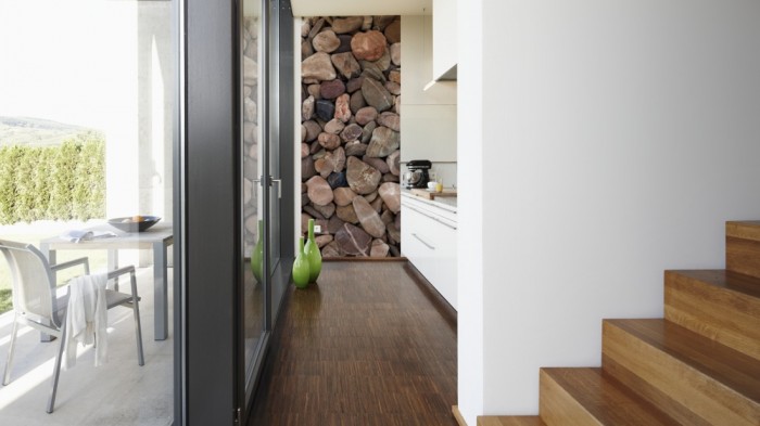 Ein Foto von dem 3D-Fotopanel Steine im Wasser tapeziert in der Küche. Bestelle Deine Bildtapete online.