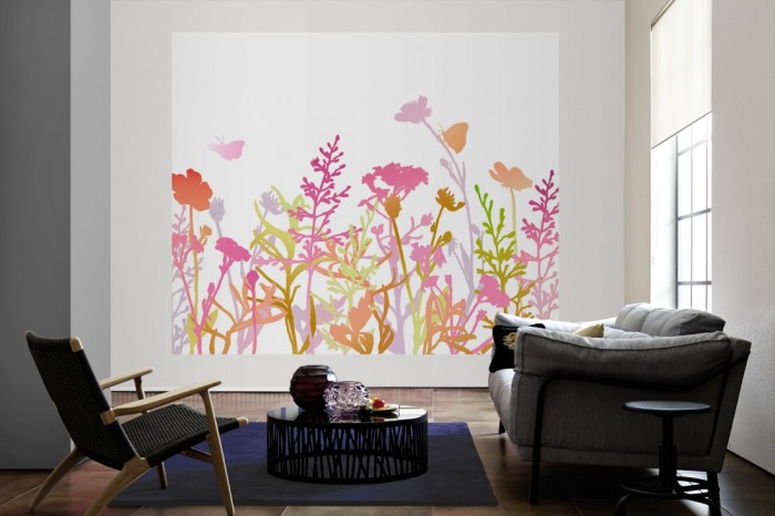 Die Design-Fototapete Bunte Blumenwiese, Artwork als große Bildtapete im Wohnzimmer. Als Bildtapete ist die Design-Fototapete Bunte Blumenwiese, Artwork ein besonderes Highlight auf Vliestapete.