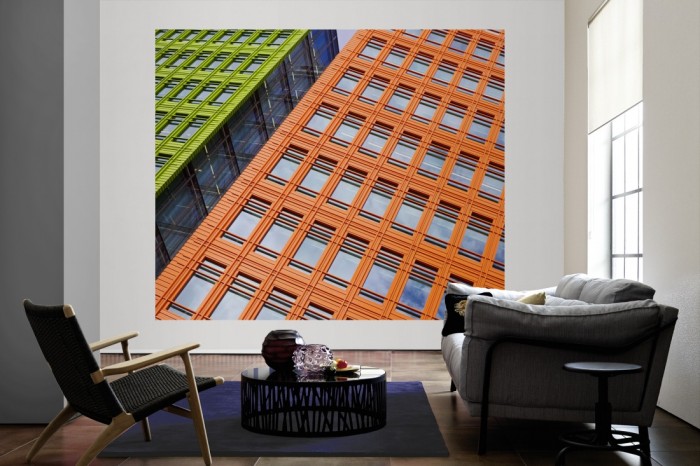 Die Fototapete Wolkenkratzer Fassaden als große Bildtapete im Wohnzimmer. Als Bildtapete ist die Fototapete Wolkenkratzer Fassaden ein besonderes Highlight auf Vliestapete.